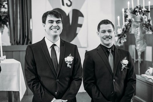 groom smiling at bride